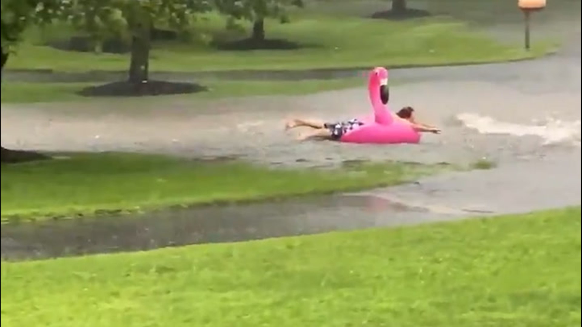 A man in Woolwich Township, New Jersey, decided to make the best of bad situation on Aug. 7 by riding his flamingo float down the flooded street.