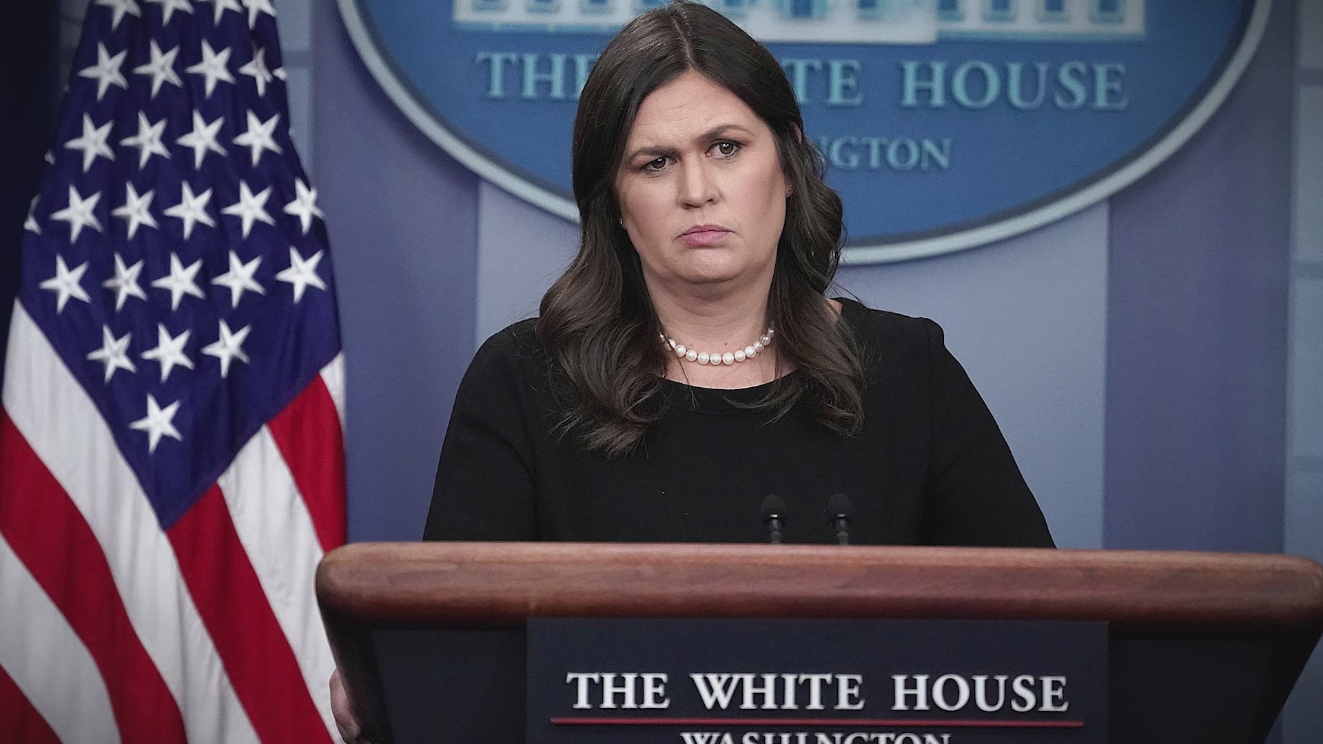 The video shows a White House intern trying to take a microphone from CNN reporter Jim Acosta.