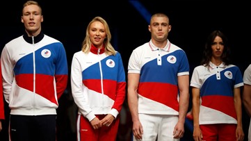 Russia's flag banned but national colors on Olympic uniforms