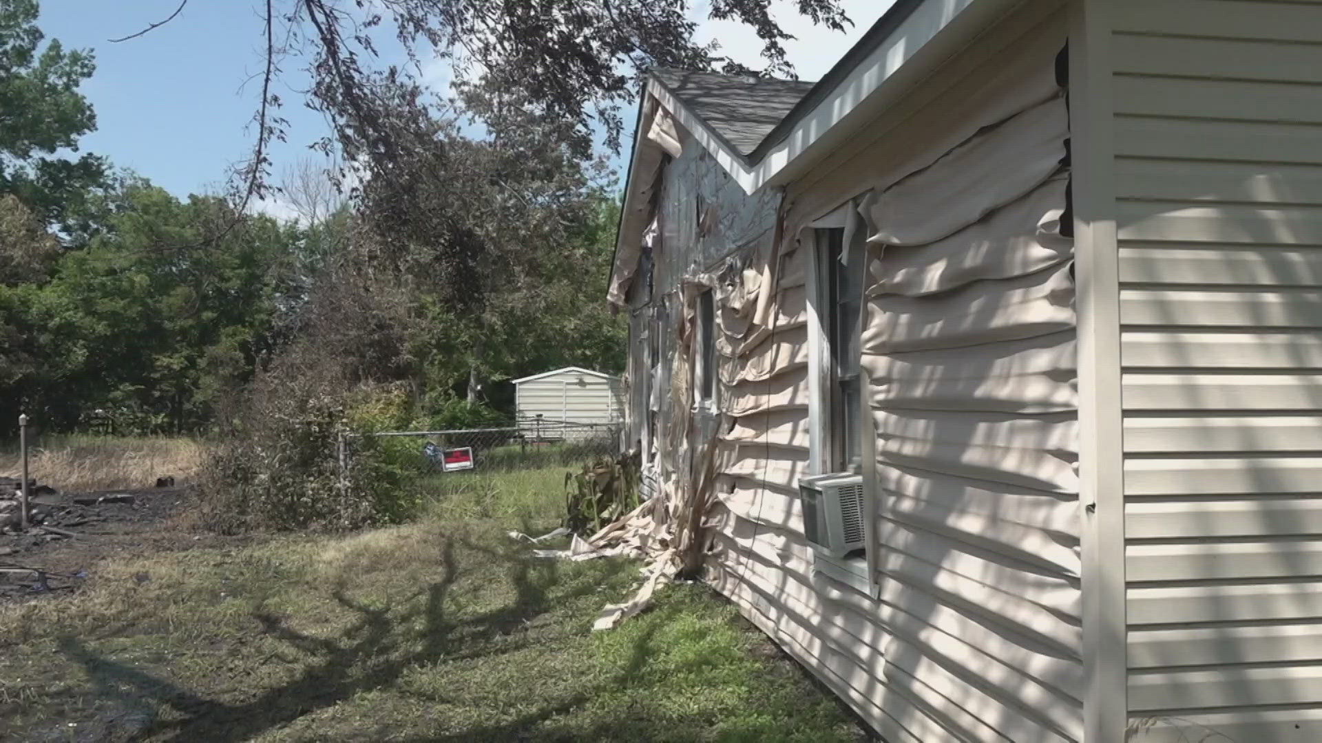 A Lacy Lakeview couple said their home was damaged after a fire department training exercise on an abandoned home next to theirs.