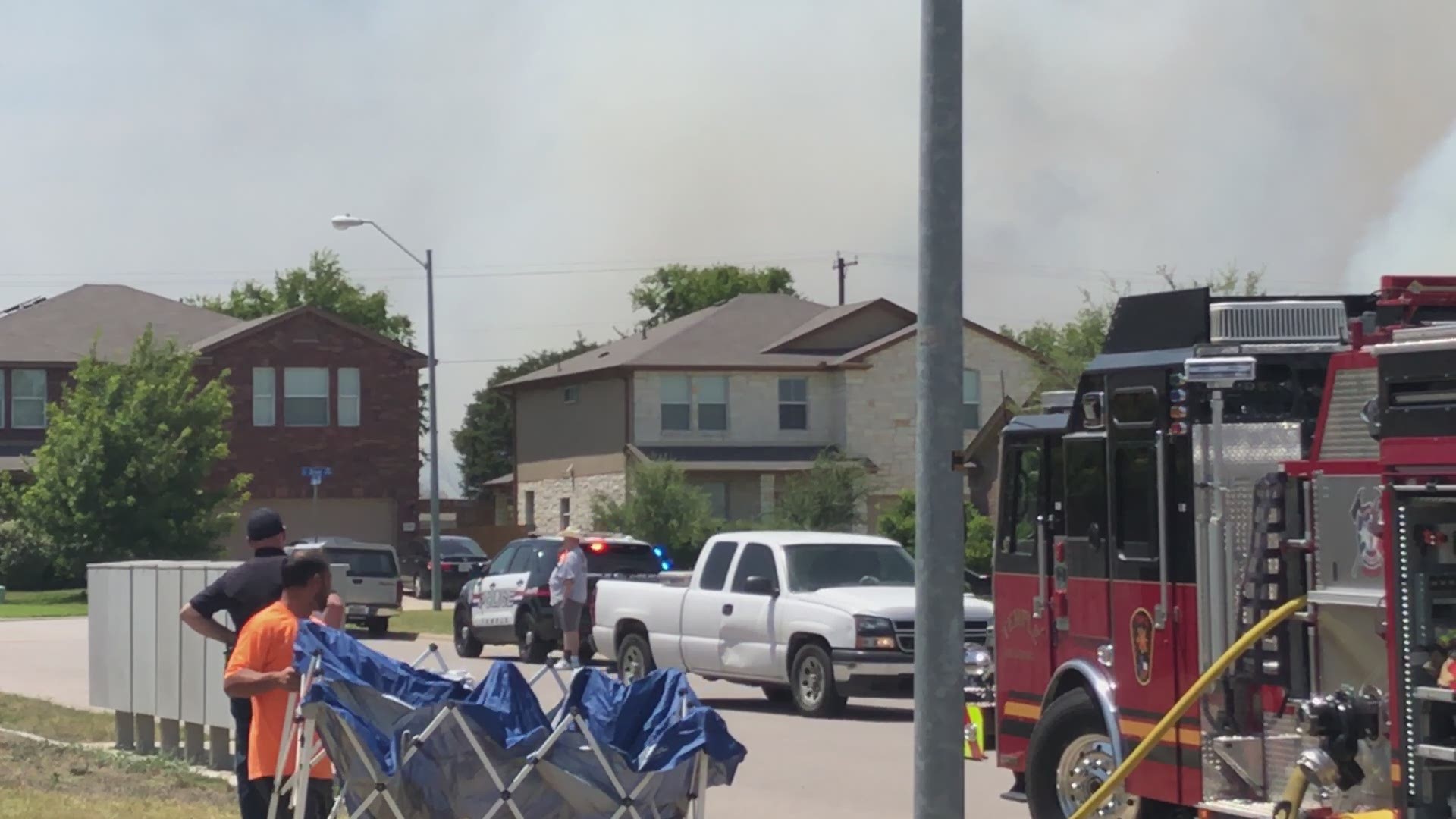 A fire was burning near the Windmill Farms neighborhood Friday forcing residents to evacuate.