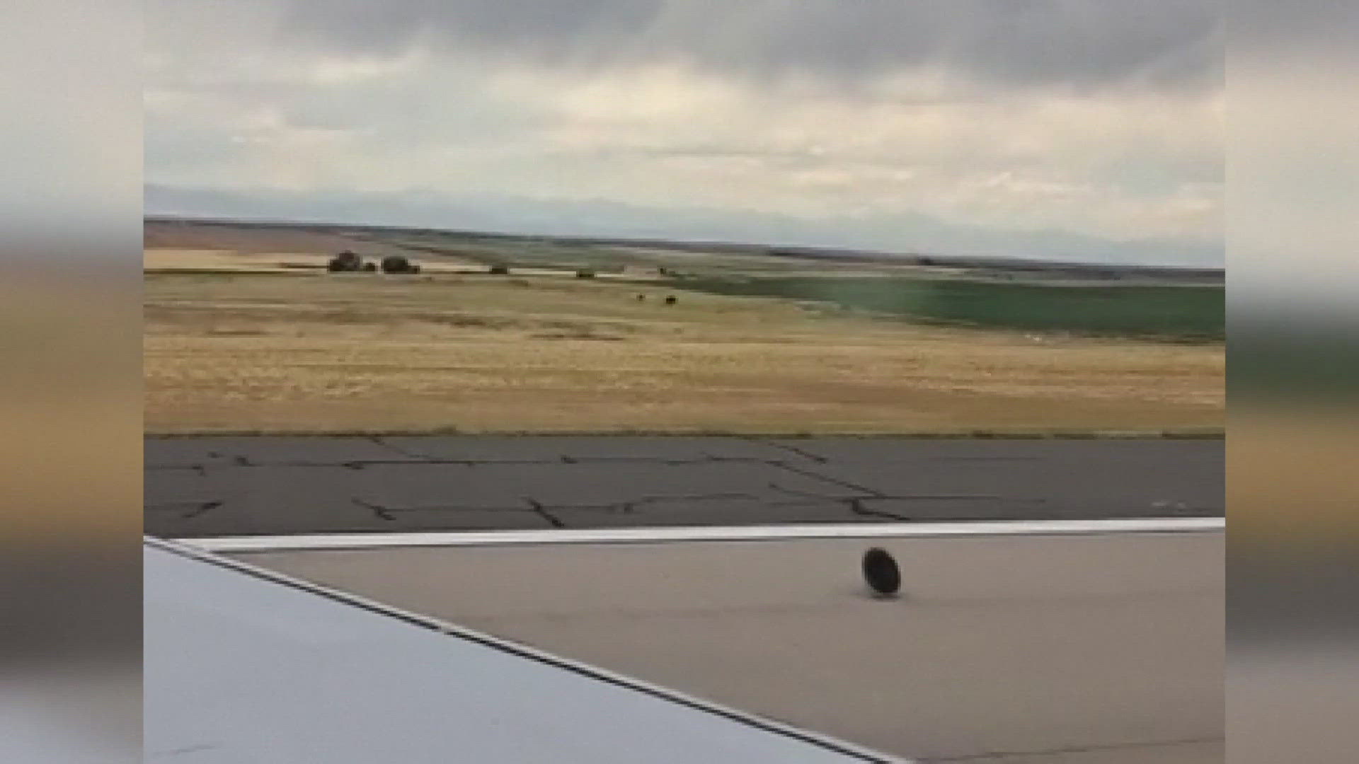 A passenger recorded a wheel coming off the plane. No injuries were reported. 