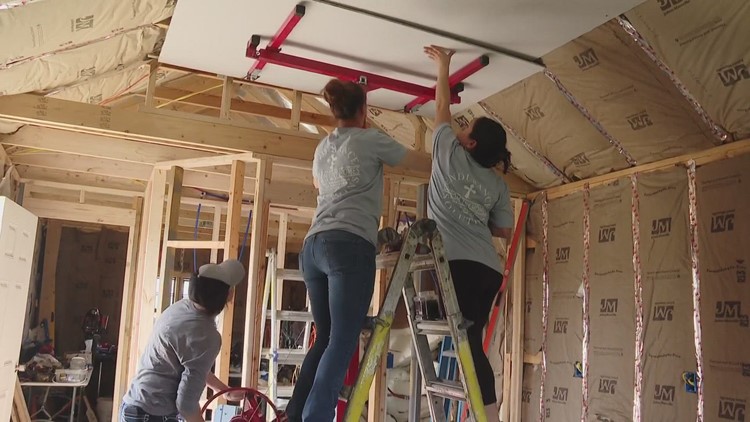 Women at Endurance Solutions help build tiny homes for the community