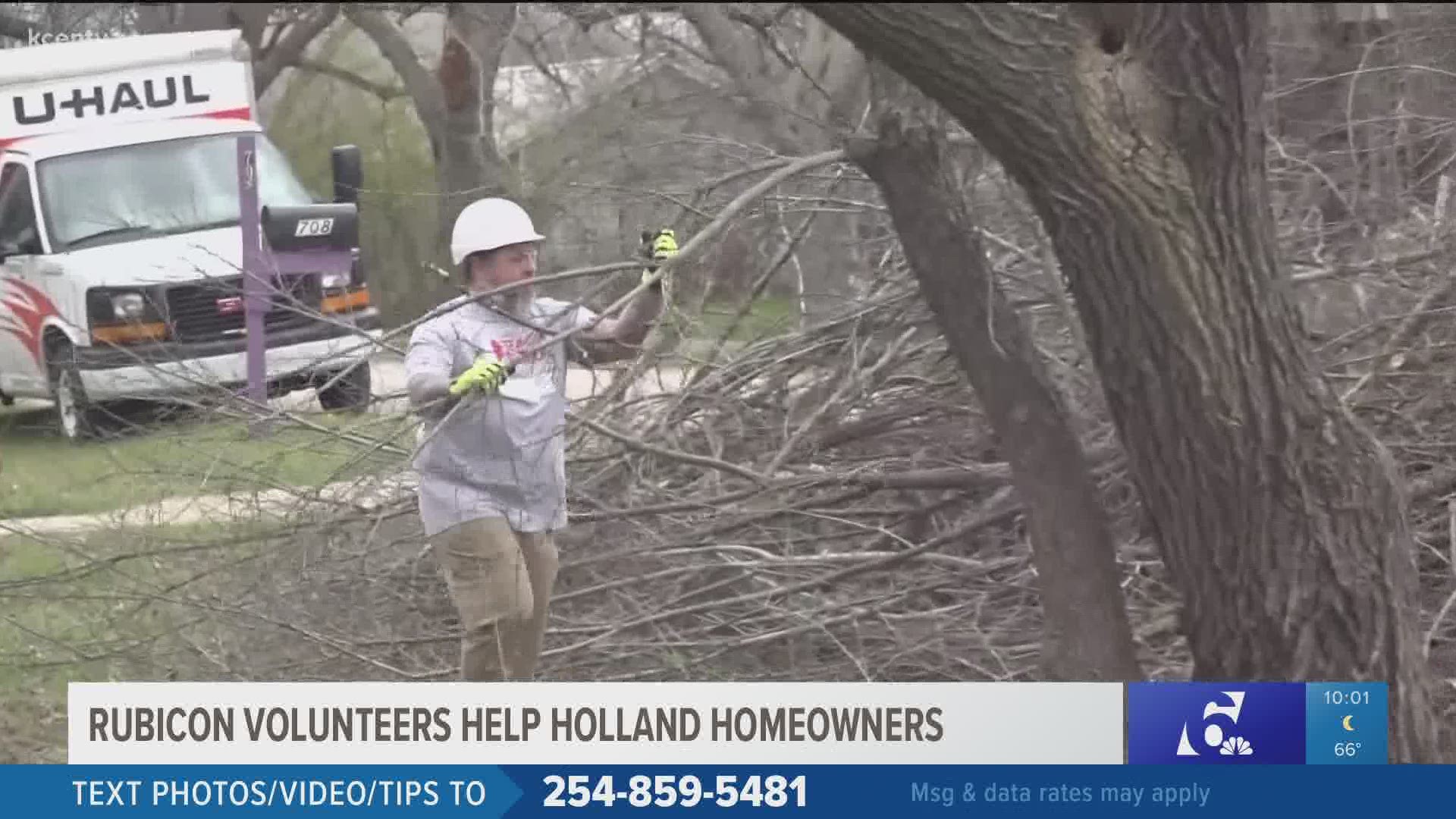 Long limbs hanging off trees were still posing a threat weeks after the historic winter storm, and one non-profit stepped up to help Holland residents.