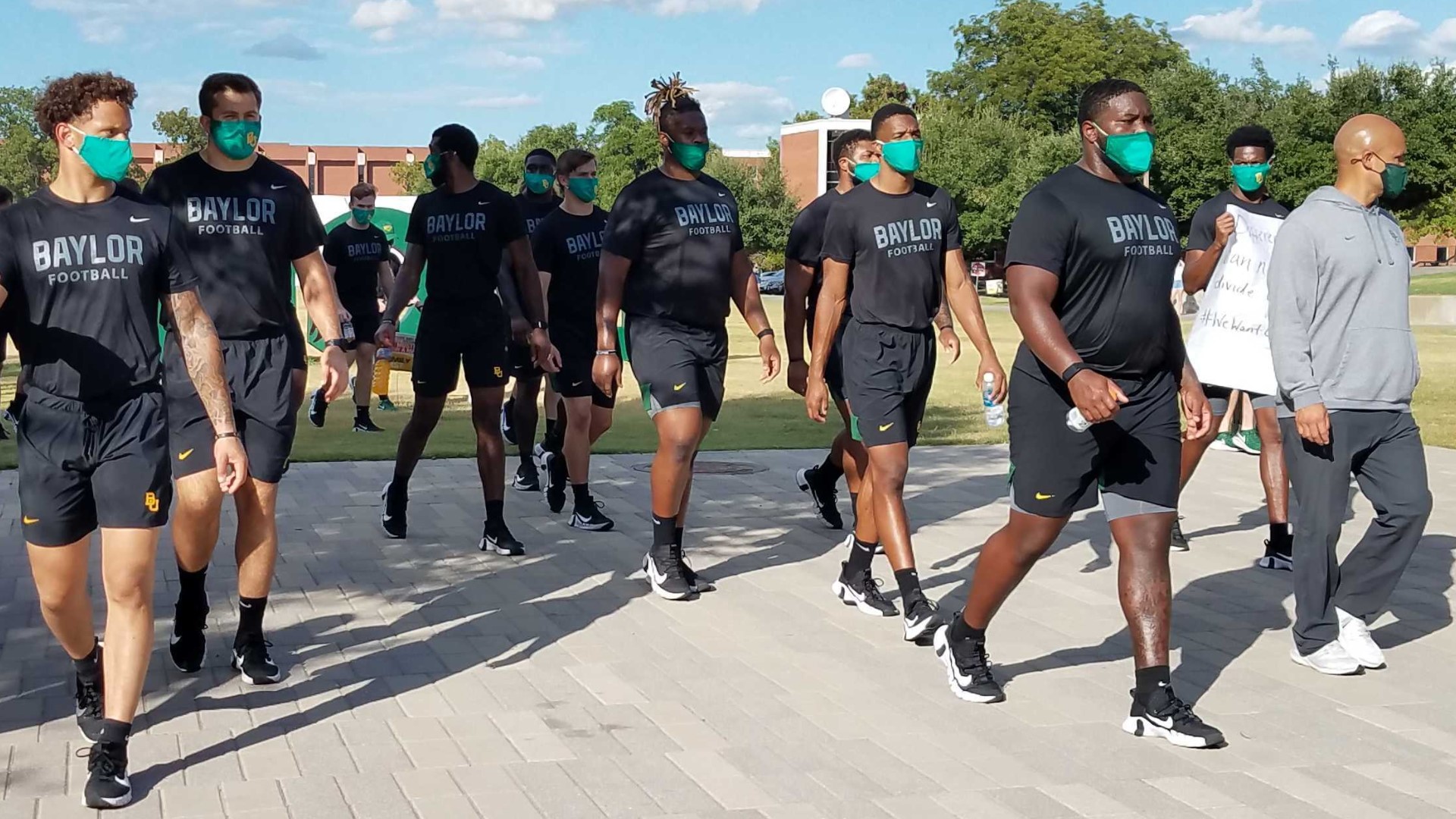 Baylor football players marched across campus Thursday in protest of the shooting of Jacob Blake.