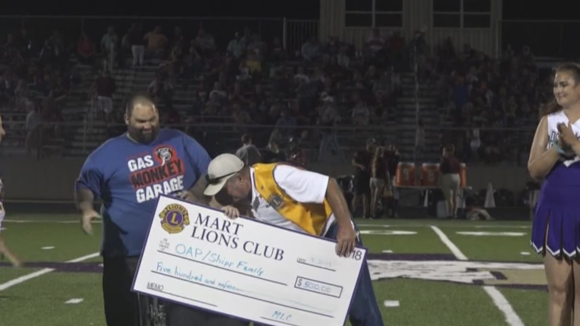 The Mart Lions Club presented David and Amanda Shipp with a $500 check along with donations, including furniture, at Friday night's football game.