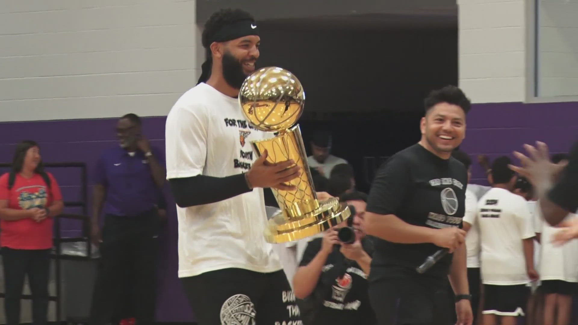 NBA champ Kenrich Williams returned to Waco to host his free youth basketball camp, drawing a record 500 kids and surprising the Larry O’Brien Trophy with him.