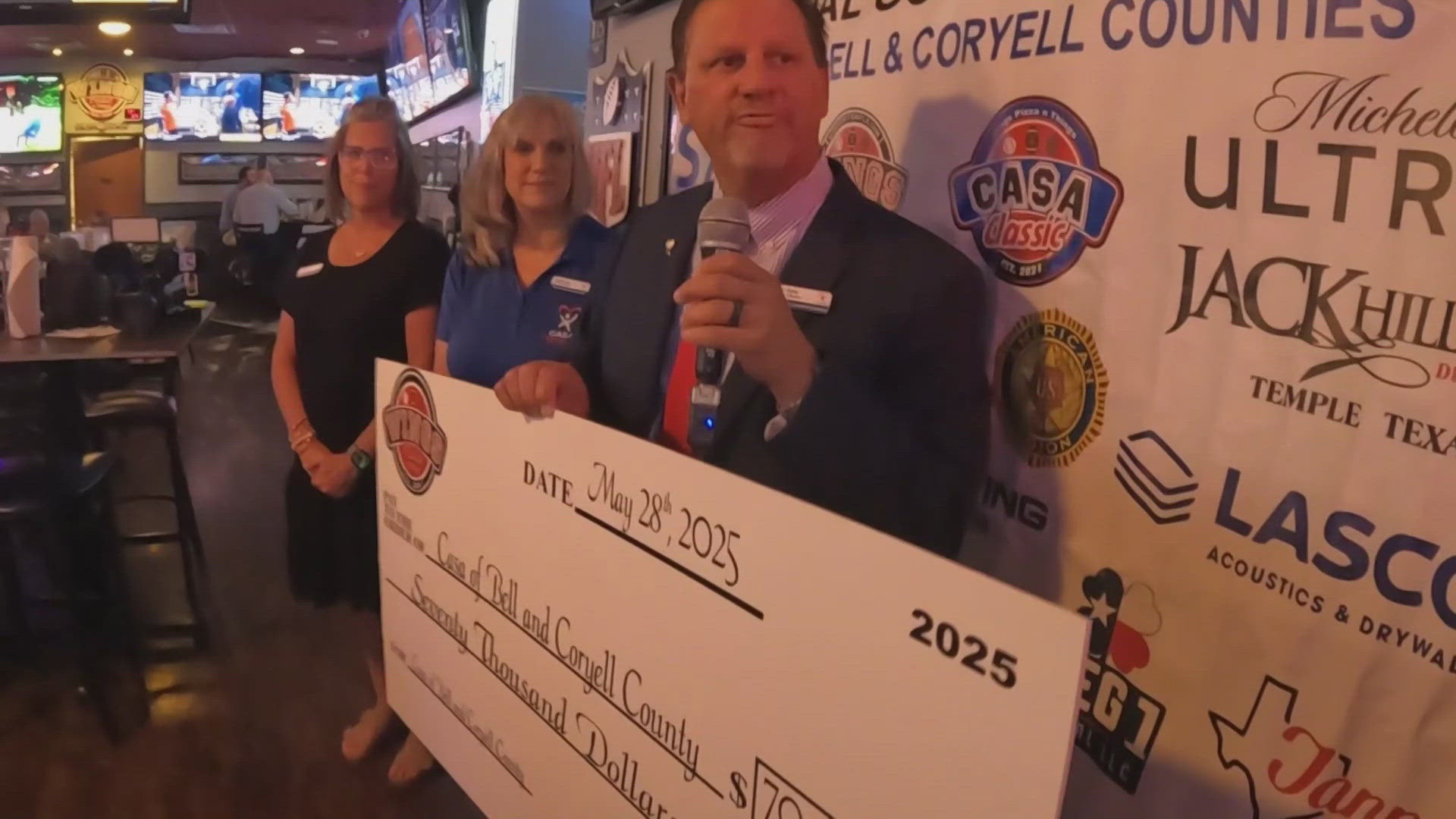 Mike and Sarah Dent of Wingz Pizza and Things presented a $70,000 donation today.
