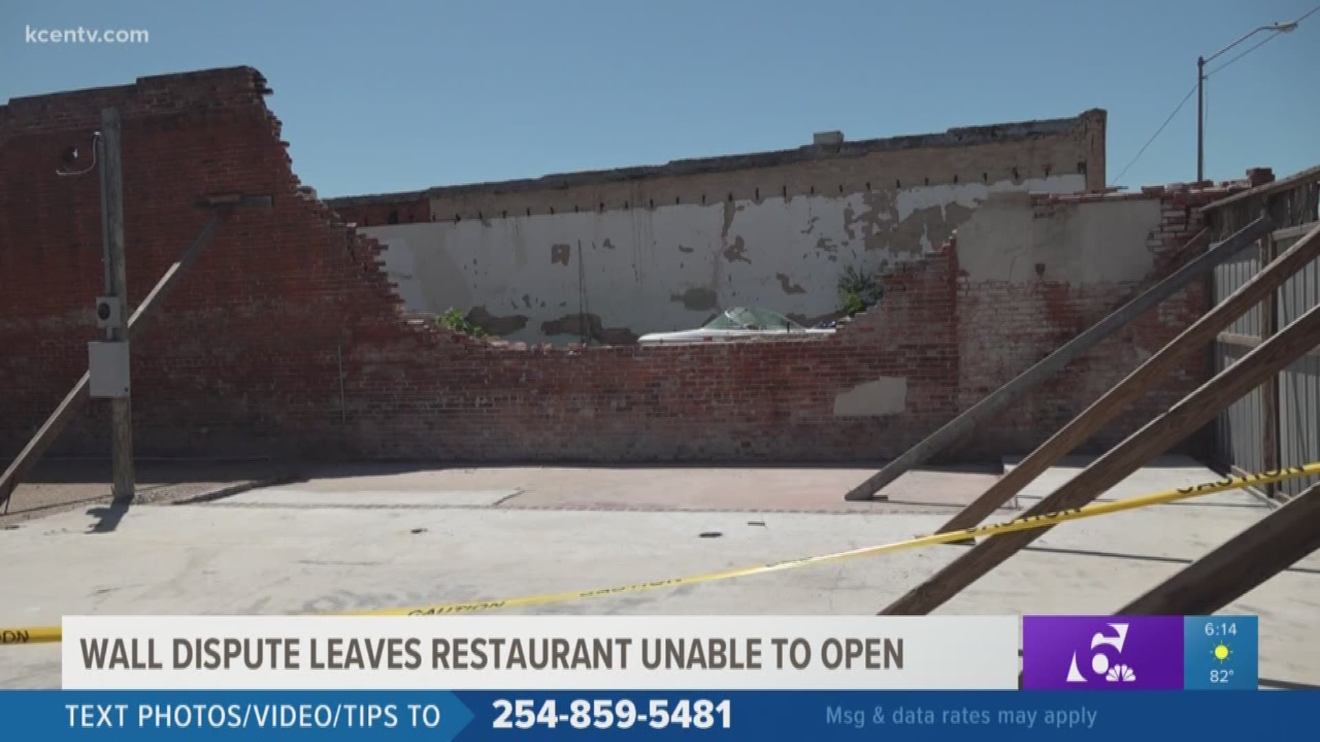 With restaurant dine-in restrictions lifting, one Central Texas business owner is still unable to open due to a wall on the verge of falling and a neighbor dispute.