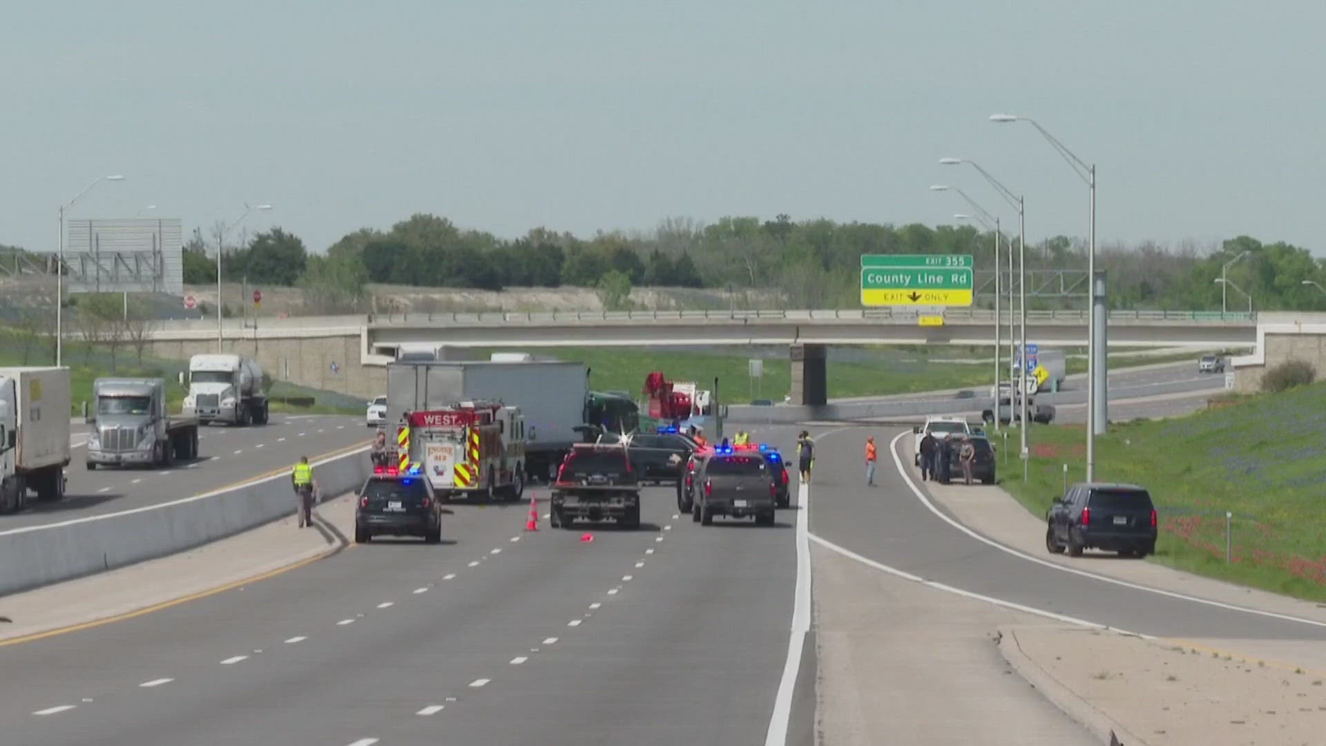 A DPS spokesman said a semi-truck ran into a fire truck and two patrol units that were on the side of the road. Two DPS troopers were also injured.