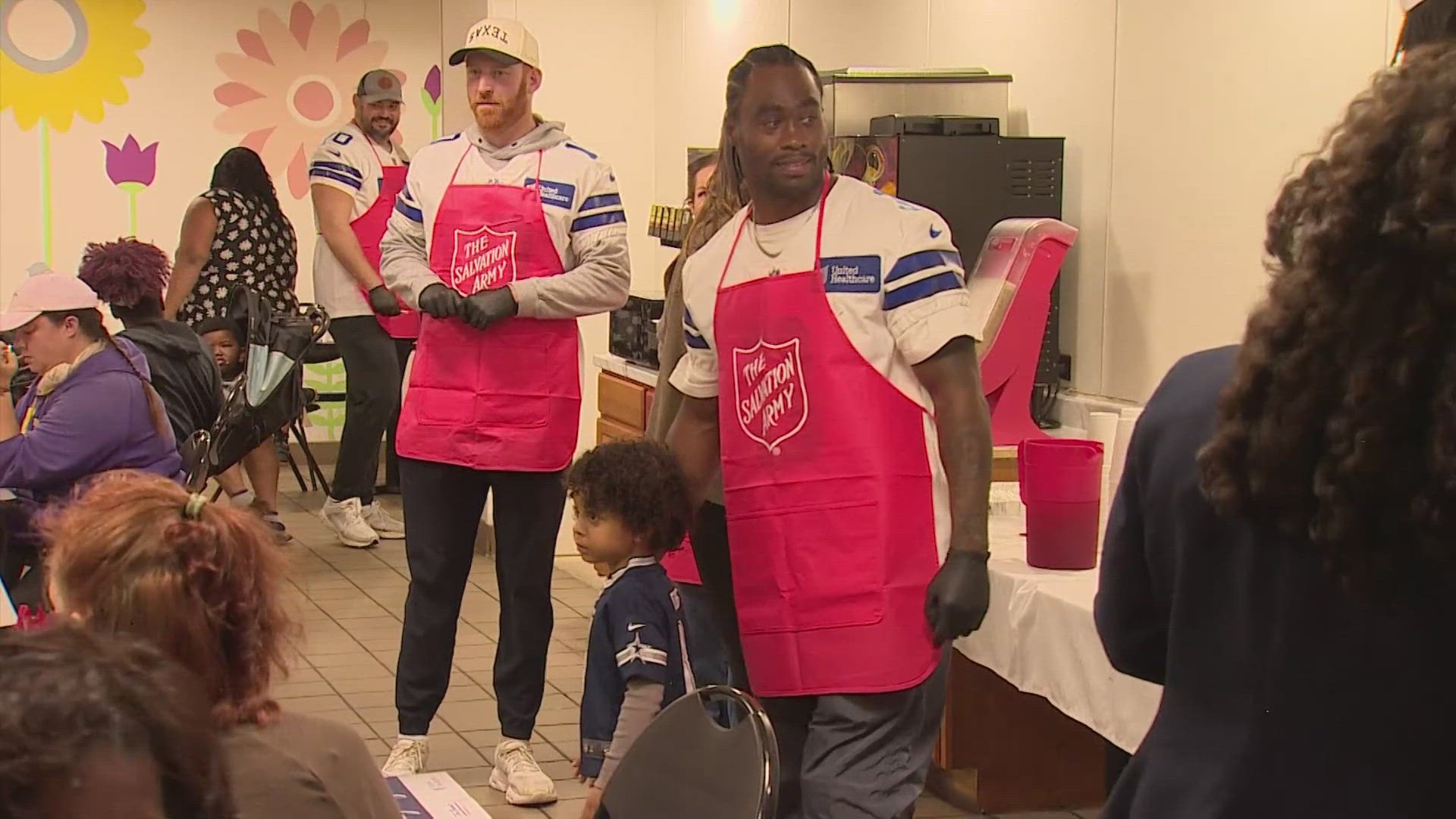 Players from the team rolled up their sleeves to help serve meals in Dallas and Fort Worth.