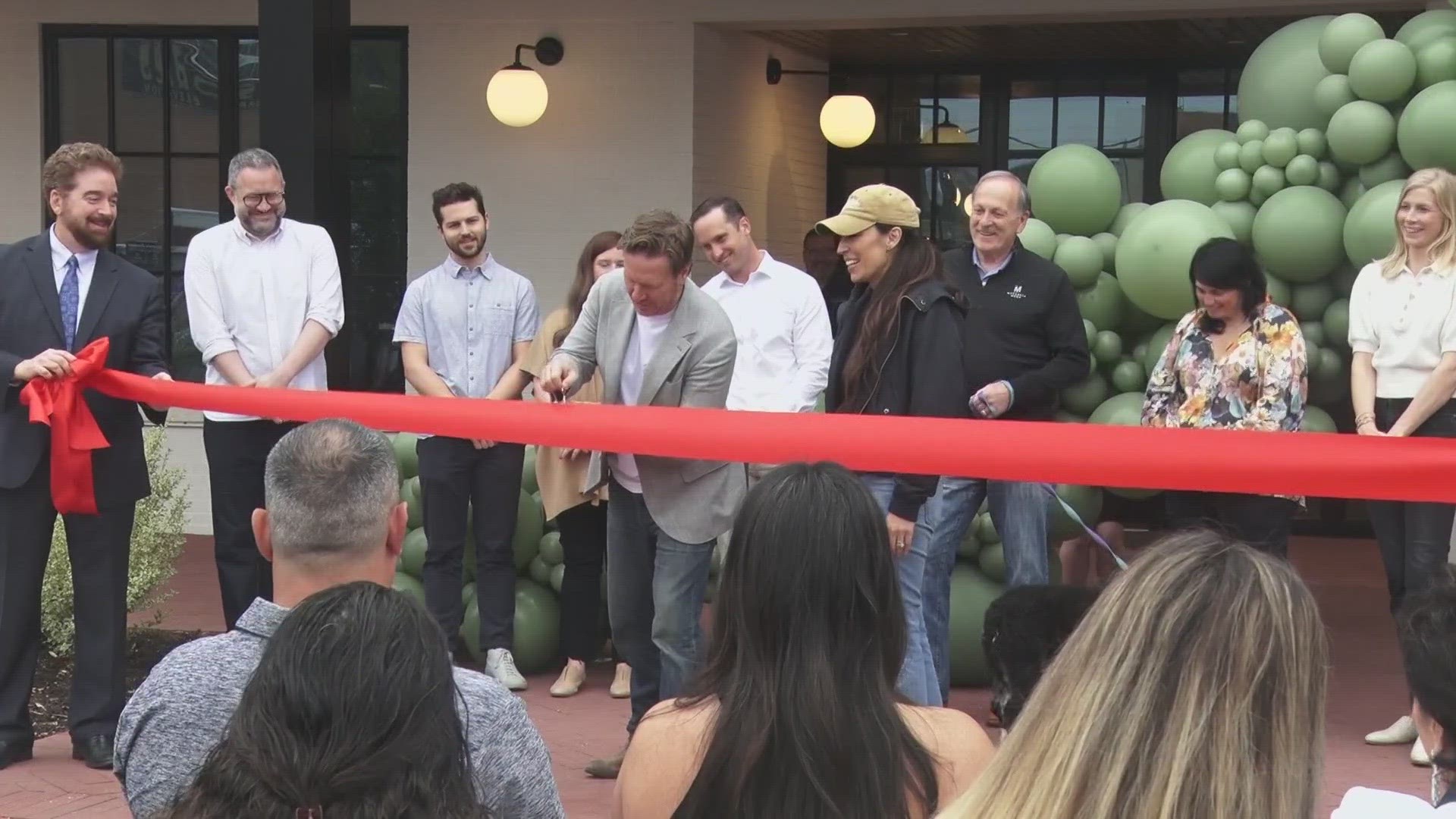 Chip and Joanna Gaines cut the ribbon at what will be the new headquarters for Magnolia.