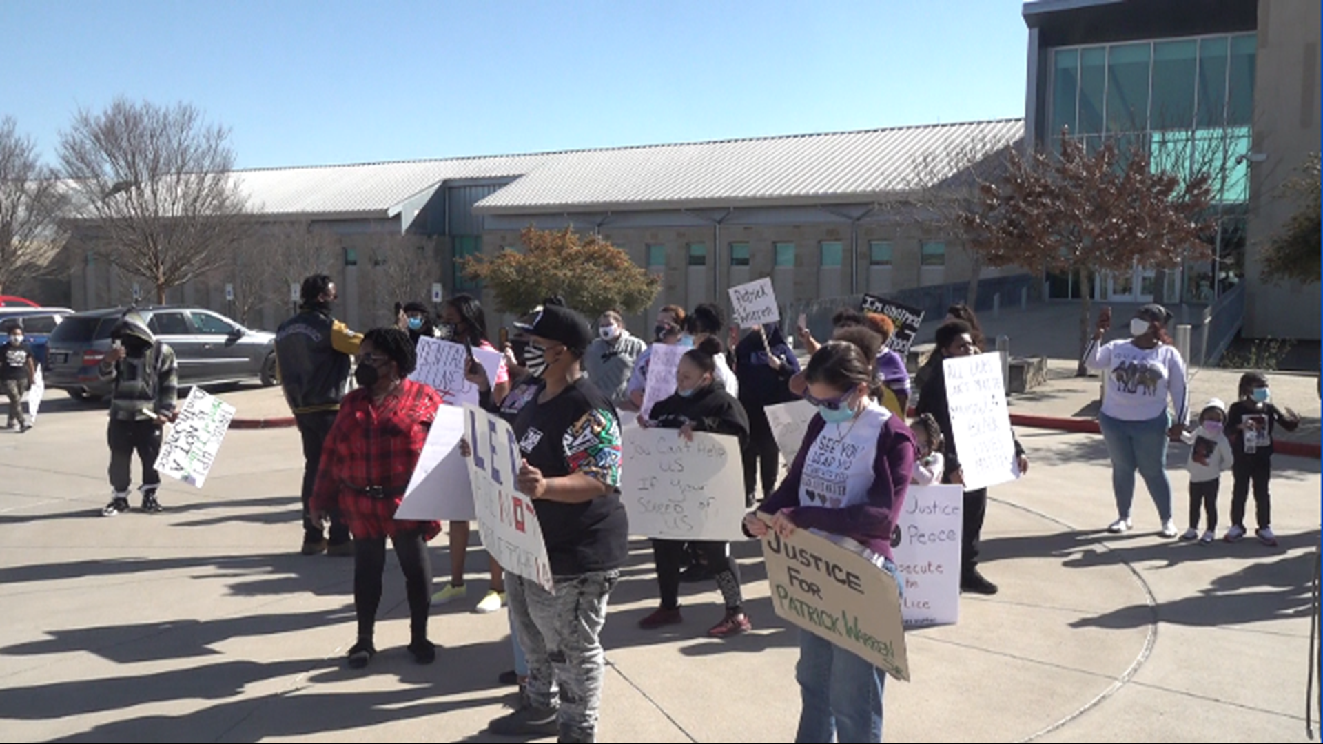 A group of about two dozen protesters called for the arrest of Officer Reynaldo Contreras.