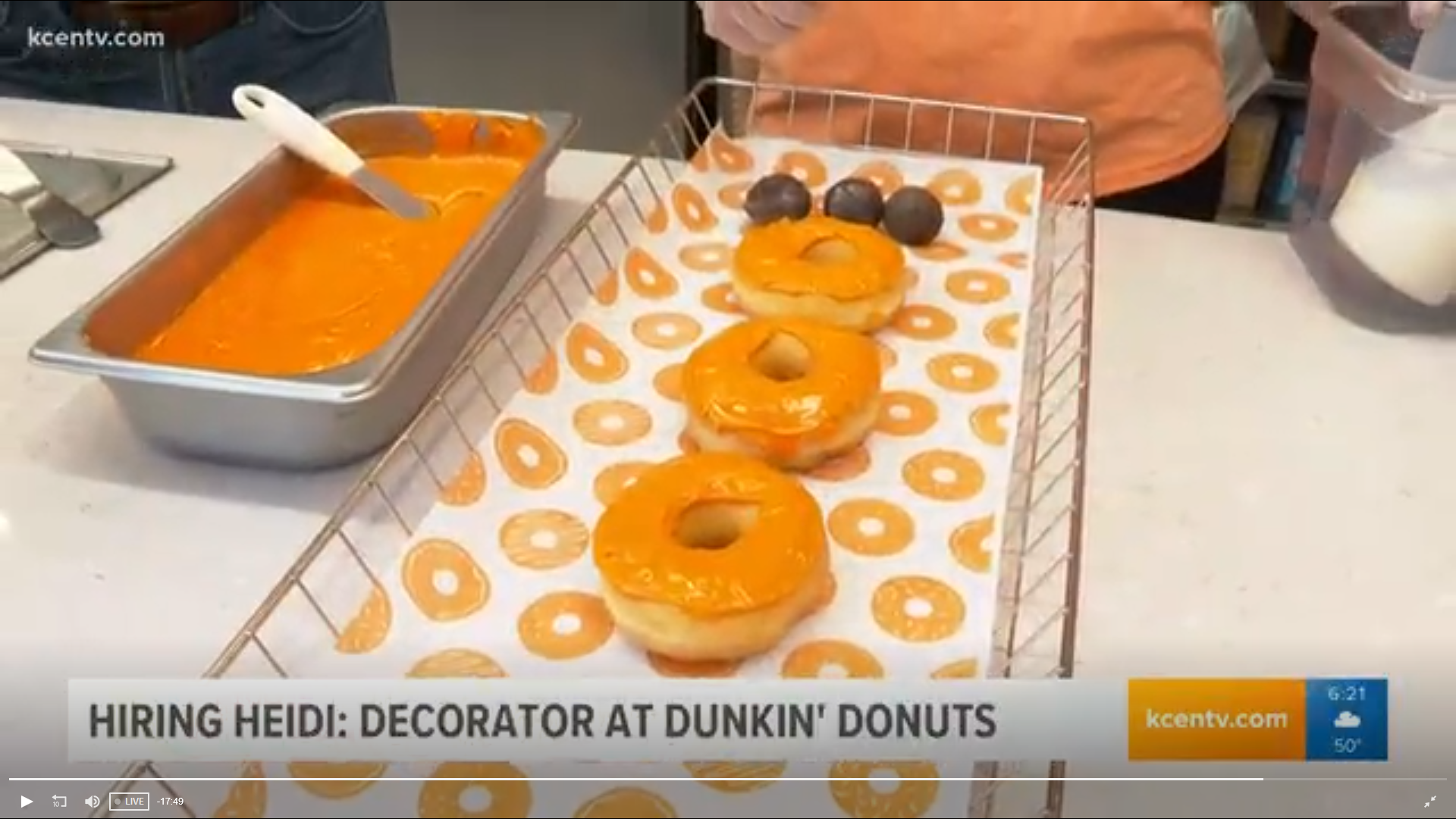 Morning anchor Heidi Alagha decorates spider donuts at Dunkin' Donuts.