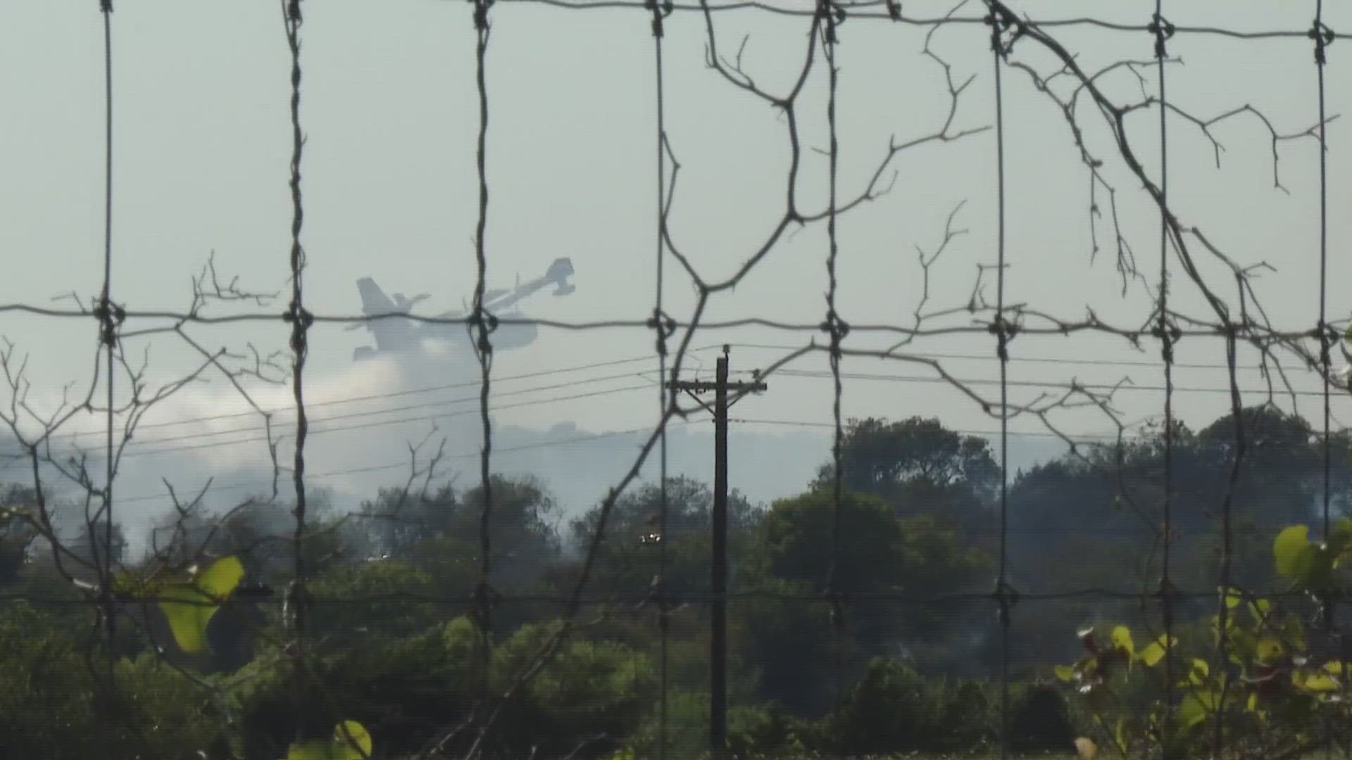 Firefighters said the fire was 100% contained on Sunday, Aug. 13, in part due to help from fire planes utilizing water from lake Waco.