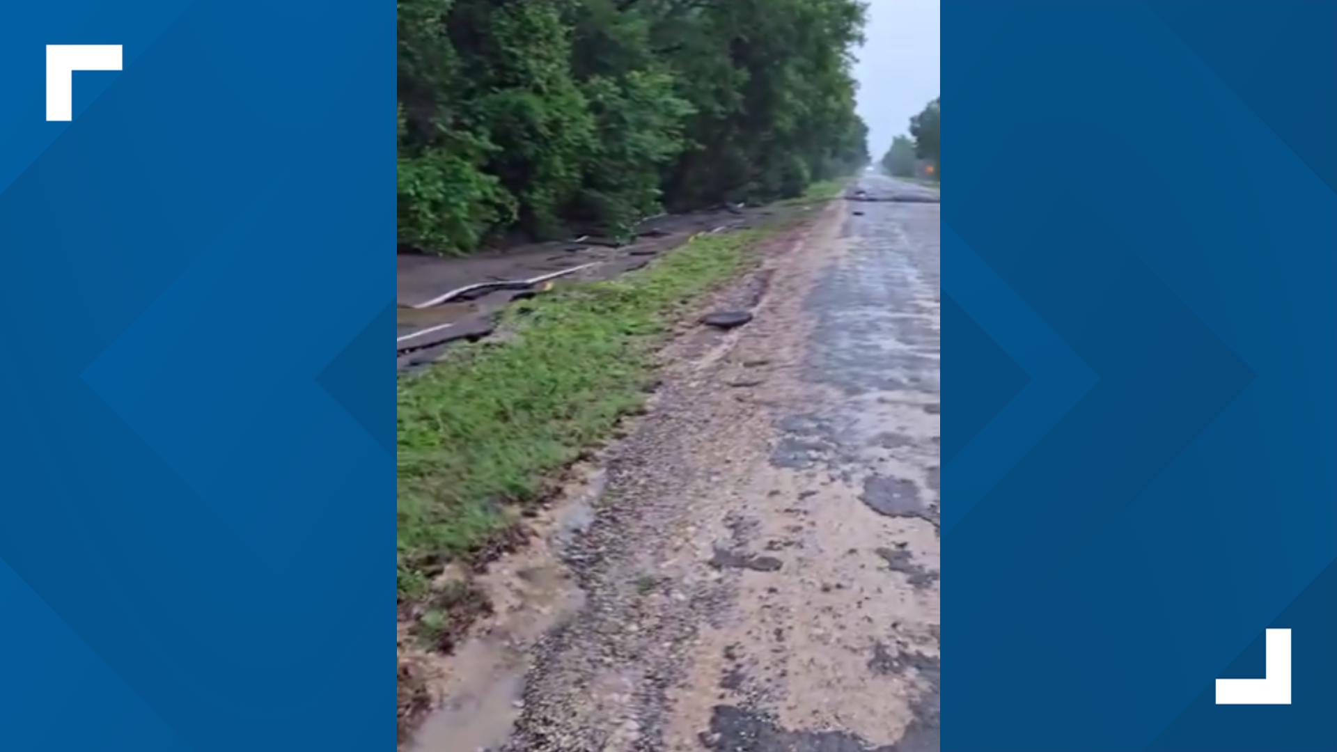 Pavement lies washed off the road along 1365 in Teague
