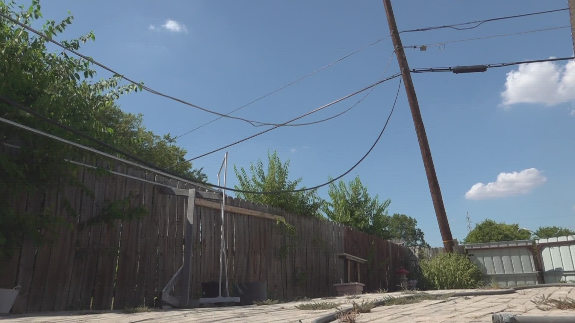 A family in Temple says an AT&T utility pole is leaning dangerously into their backyard. After four years, it's only gotten worse.