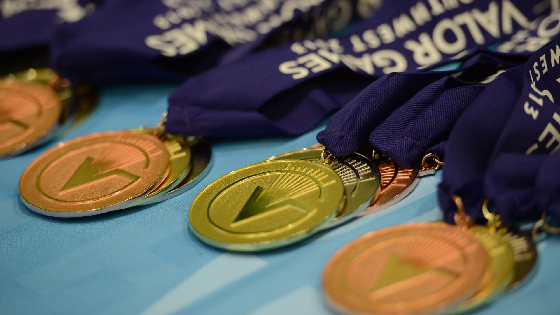 Veterans with physical disabilities compete in various games including air guns, archery, boccie ball, cycling, powerlifting, table tennis, and rowing.