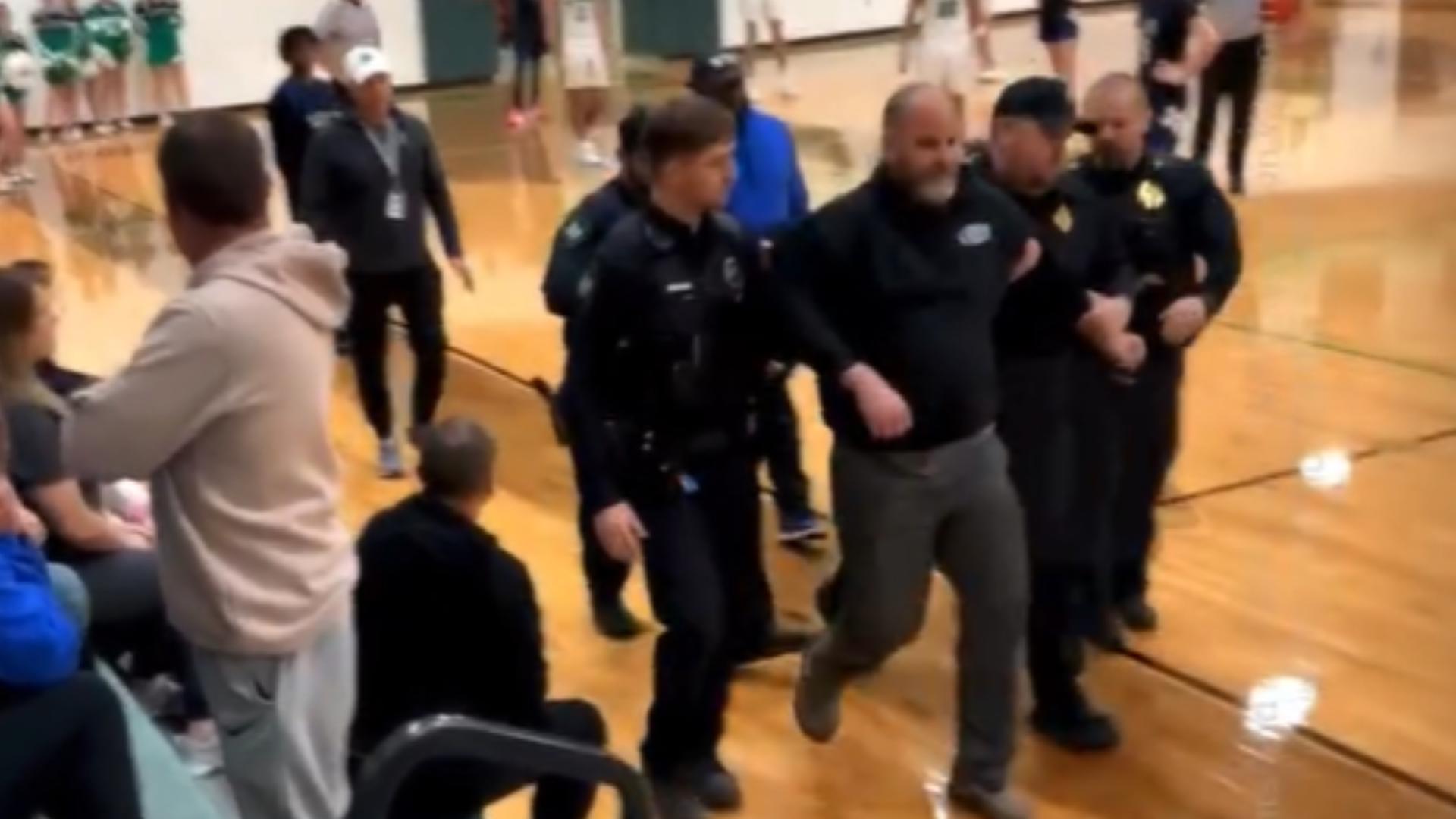 The Clifton Police Chief said a man came onto the court, was cursing at referees and had to be forcibly removed from the gym by officers.