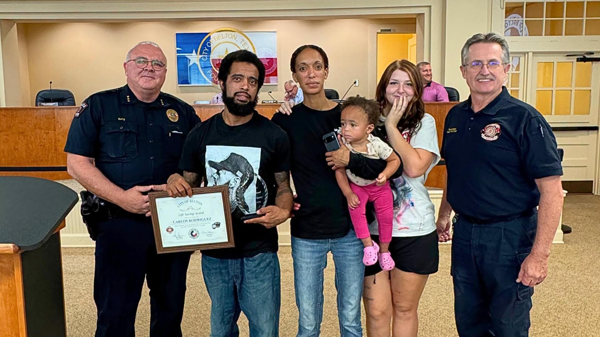Belton man honored with lifesaving award for rescuing three people from fire