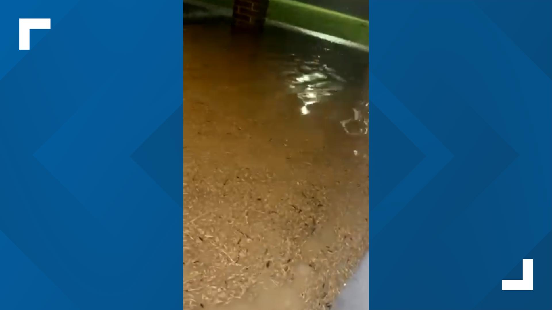 Water floods up to the door of a home in West Temple during storms on May 26. (Credit, Ashley)