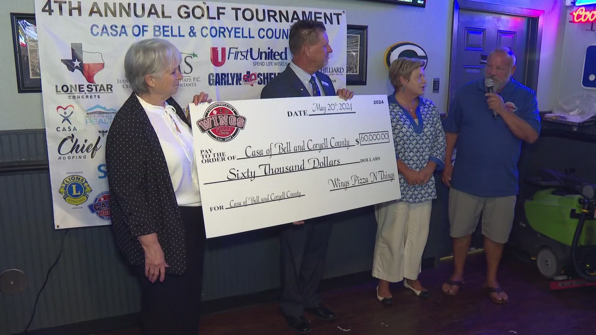 Mike and Sara Dent and Wings, Pizza N Things set a new record by giving the largest single donation to CASA to date through the annual tournament.