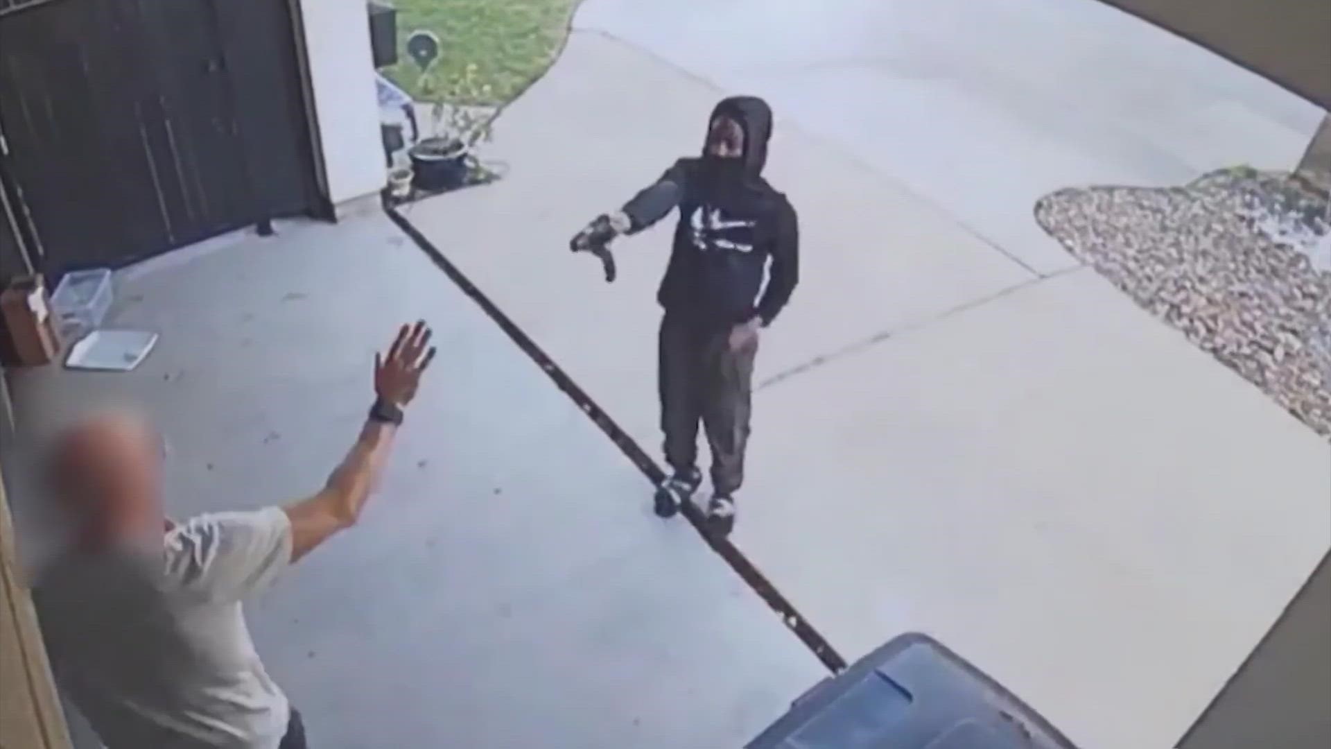 Video shows two men try to steal a man's SUV from his driveway, but police say when the suspect tried to drive off, he couldn't because his accomplice took the keys.