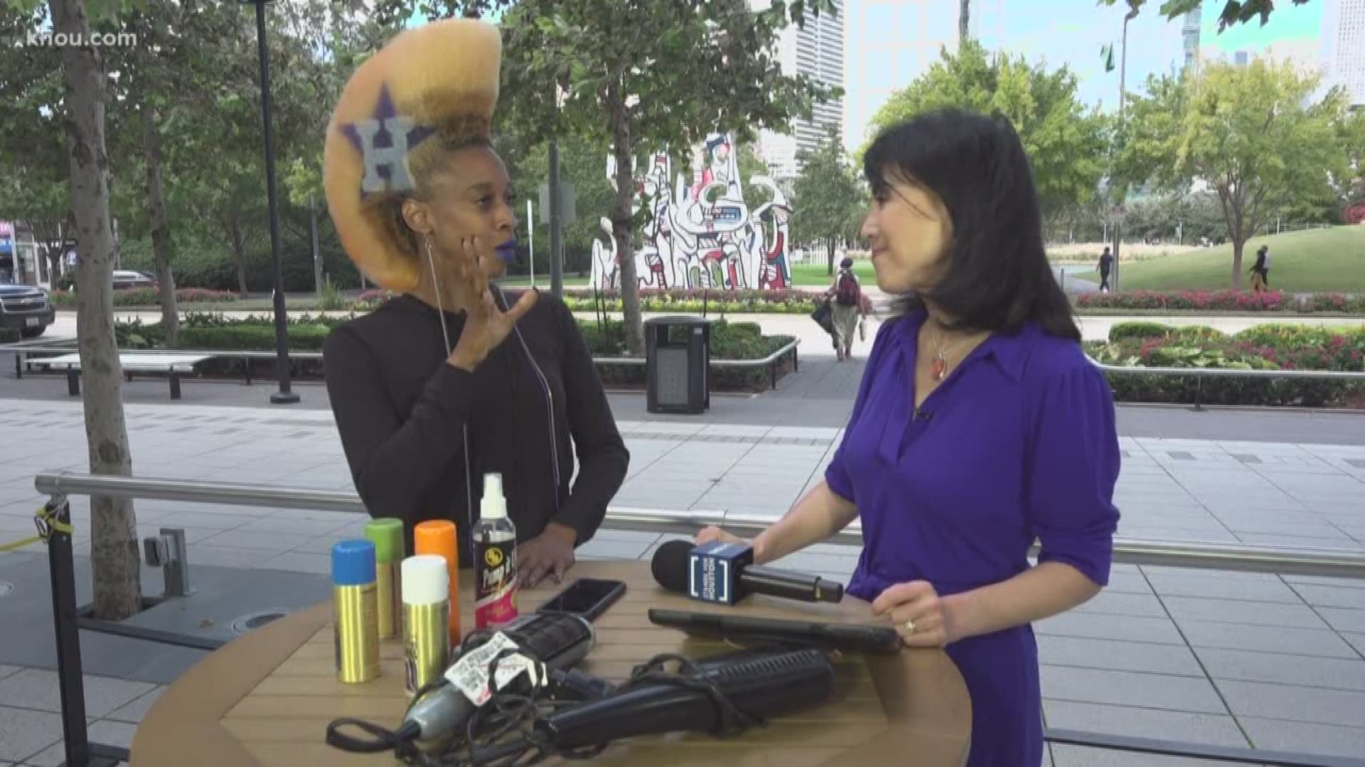 Color us impressed! Astros fan Tomekia Chaisson piles her hair into a 7-inch-tall Mohawk painted with team logos on each side.