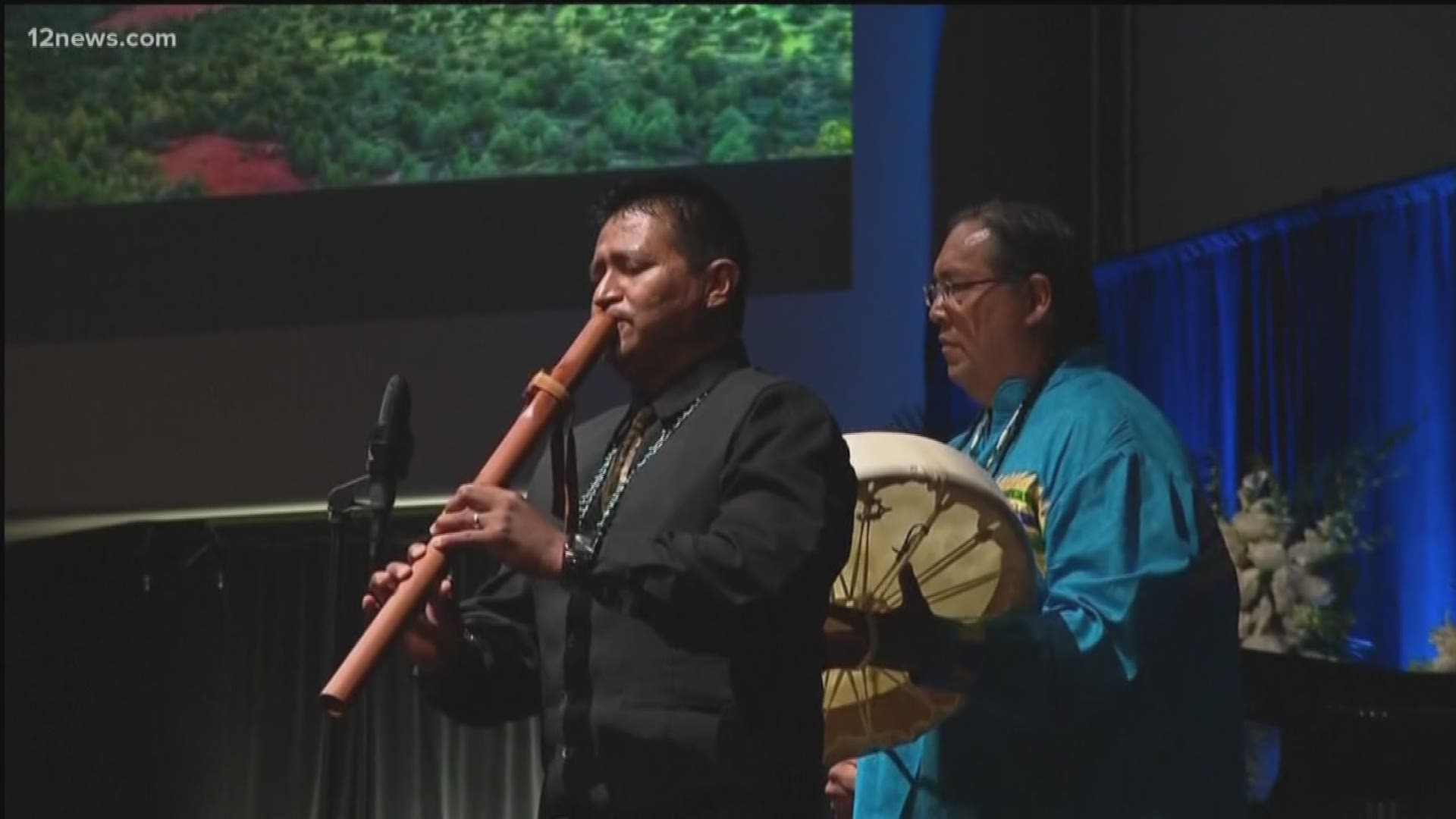 Navajo flutist Jonah Littlesunday performs a tribute to John McCain who was revered in the Navajo community. 