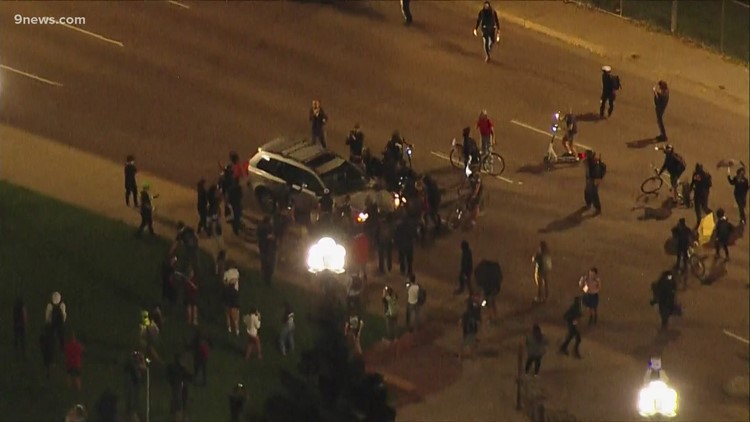 Video shows vehicle driving through crowd as protesters gather in Denver after decision in Breonna Taylor case
