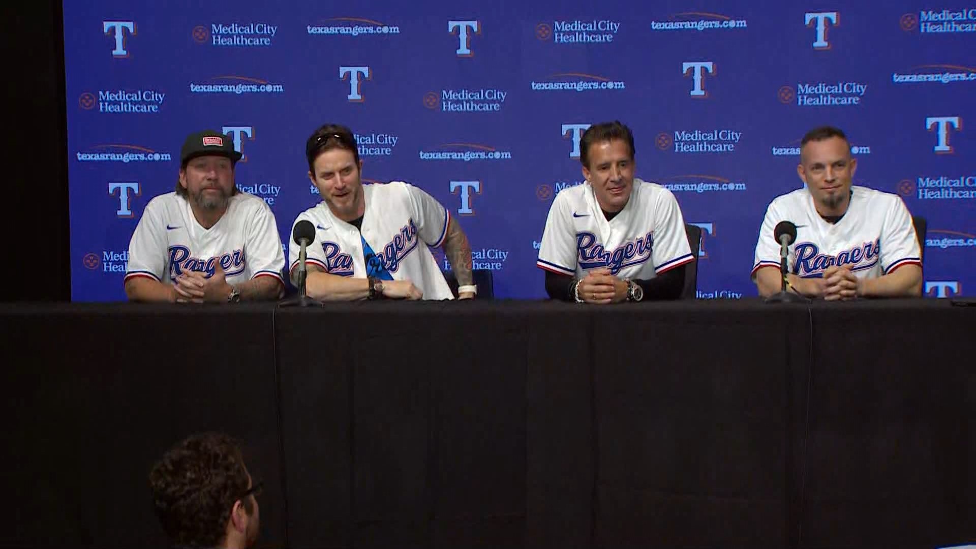 Creed band members held a press conference in Texas Rangers gear at Game 3 of the ALCS.