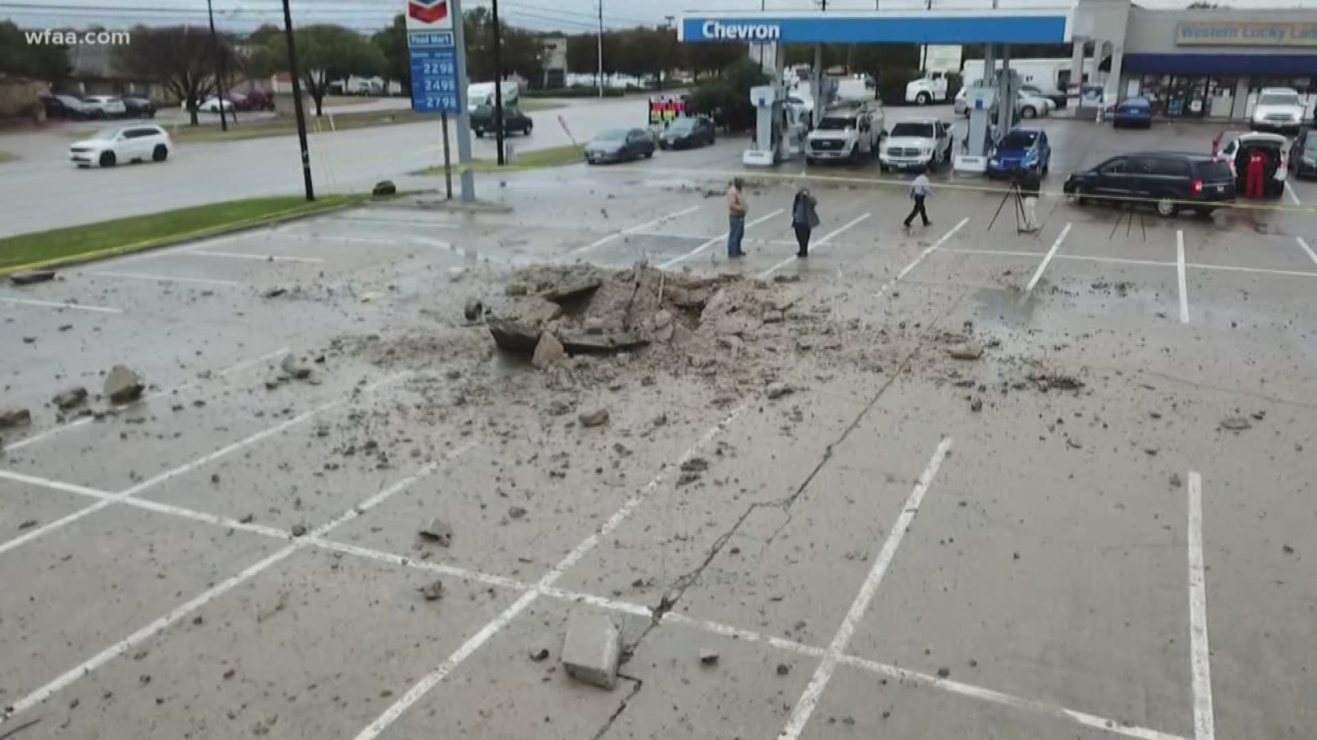 The strike caused a huge noise and sent debris at least 50 feet away from where it hit the ground near a Chevron gas station.