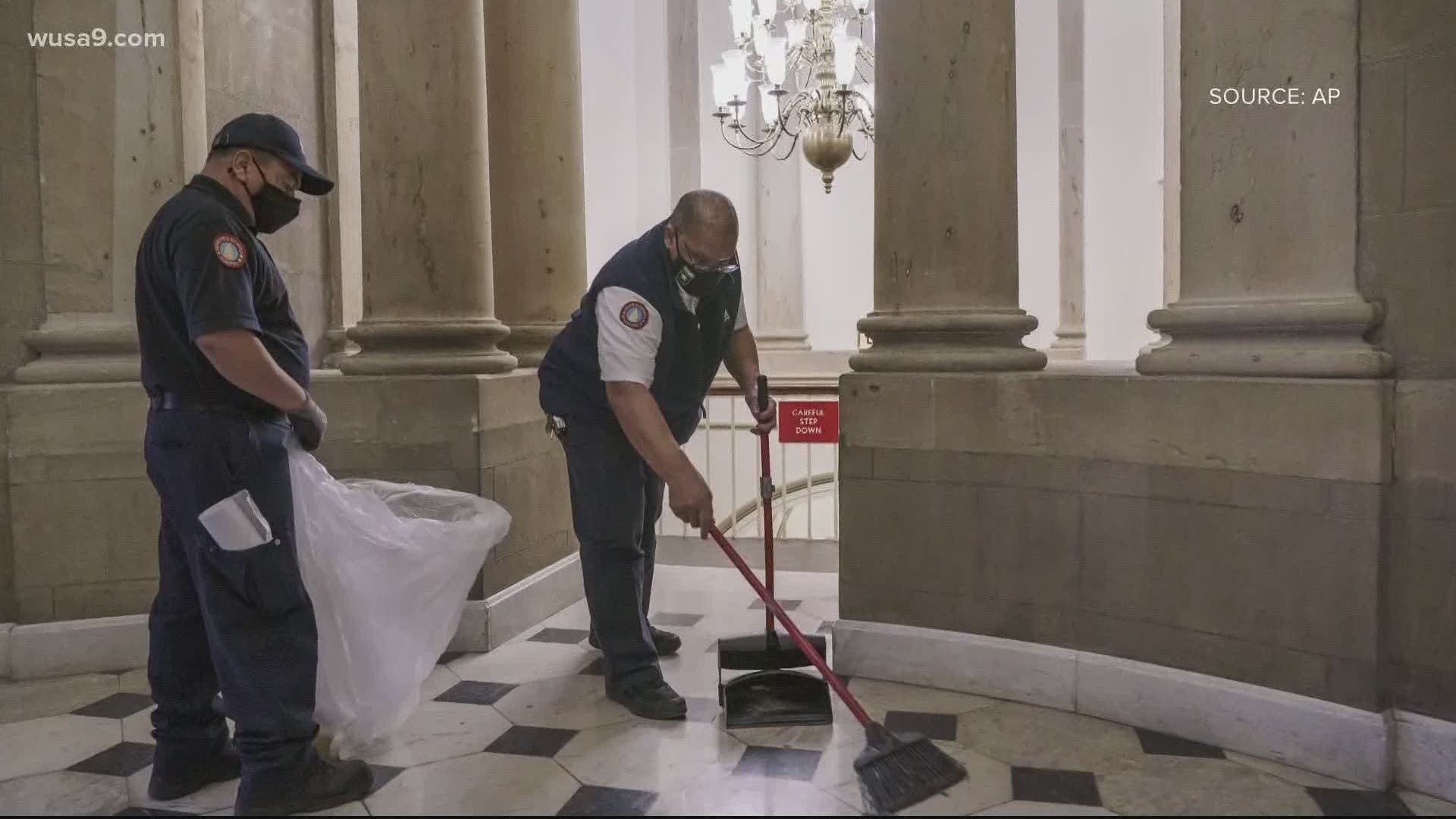A day after domestic terrorists rushed onto the grounds of the US Capitol, crews fixed broken windows and cleaned floors littered with debris on Thursday.